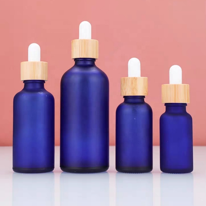 Factory Price 10ml 15ml 20ml 30ml 50ml 100ml Frosted Bamboo Lid Blue Essential Oil Glass Bottle
