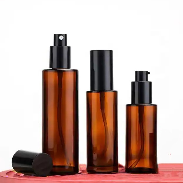 Hot Sale Amber Glass Pump Bottles With Flat Shoulder 30ml 50ml 80ml 100ml Refillable Serum Essential Oil Perfume Lotion Bottle