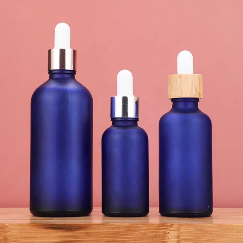 Factory Price 10ml 15ml 20ml 30ml 50ml 100ml Frosted Bamboo Lid Blue Essential Oil Glass Bottle