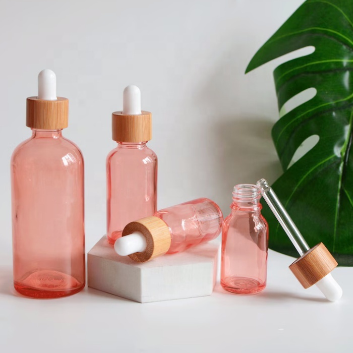 Manufacturer Round Glass Bottle 1 Oz Pink Glass Bottle 15 20 50 Ml Dropper Glass Bottle With Bamboo Cap for Cosmetic Packaging