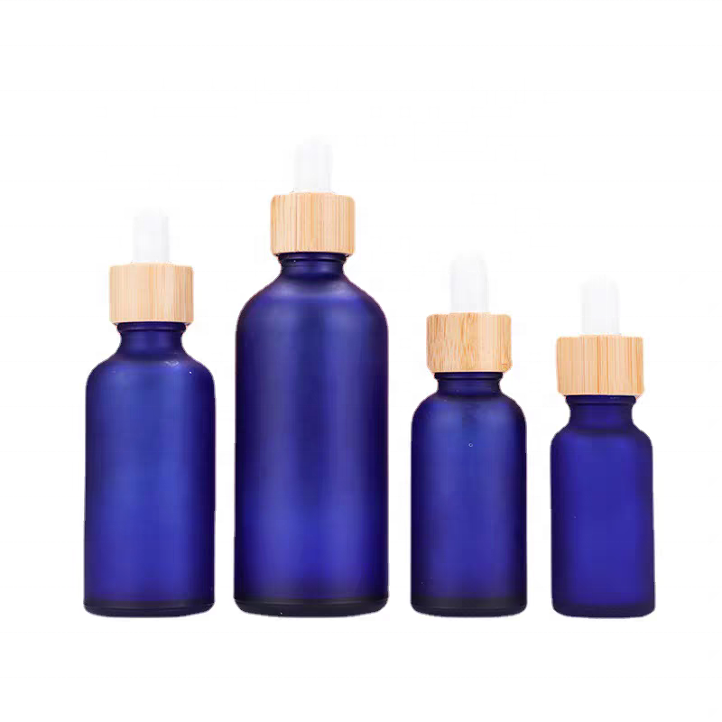 Factory Price 10ml 15ml 20ml 30ml 50ml 100ml Frosted Bamboo Lid Blue Essential Oil Glass Bottle
