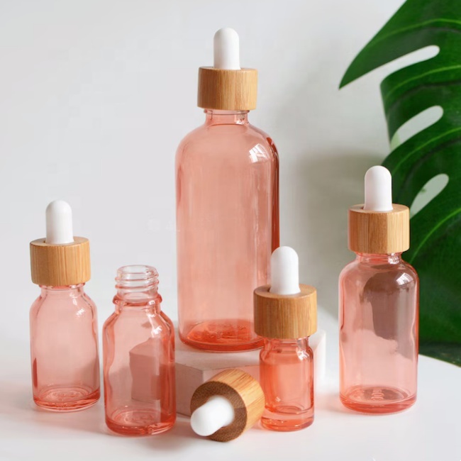 Manufacturer Round Glass Bottle 1 Oz Pink Glass Bottle 15 20 50 Ml Dropper Glass Bottle With Bamboo Cap for Cosmetic Packaging