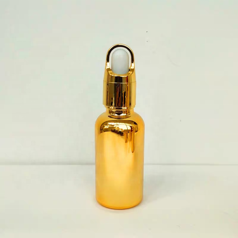 Luxury Cosmetic Packaging Essential Oil Small Round Empty Shiny Silver Gold Dropper Oil Bottle With Unique Flower Basket Rubber